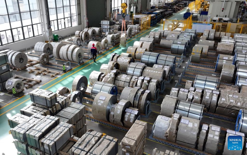 An aerial drone photo taken on March 31, 2025 shows a lifting machine transferring materials at a workshop of an auto parts manufacturing company in Feixi County of Hefei, east China's Anhui Province. In recent years, Feixi County has fostered the cluster development of emerging industries including new energy and intelligent connected vehicles, integrated circuits, advanced photovoltaic and energy storage, biomedicine, low-altitude economy, etc. to inject momentum into the county's high-quality economic development. (Photo: Xinhua)