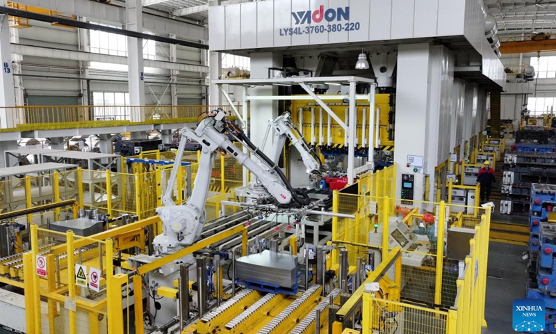 Robotic arms operate at a workshop of an auto parts manufacturing company in Feixi County of Hefei, east China's Anhui Province, March 31, 2025. In recent years, Feixi County has fostered the cluster development of emerging industries including new energy and intelligent connected vehicles, integrated circuits, advanced photovoltaic and energy storage, biomedicine, low-altitude economy, etc. to inject momentum into the county's high-quality economic development. (Photo: Xinhua)