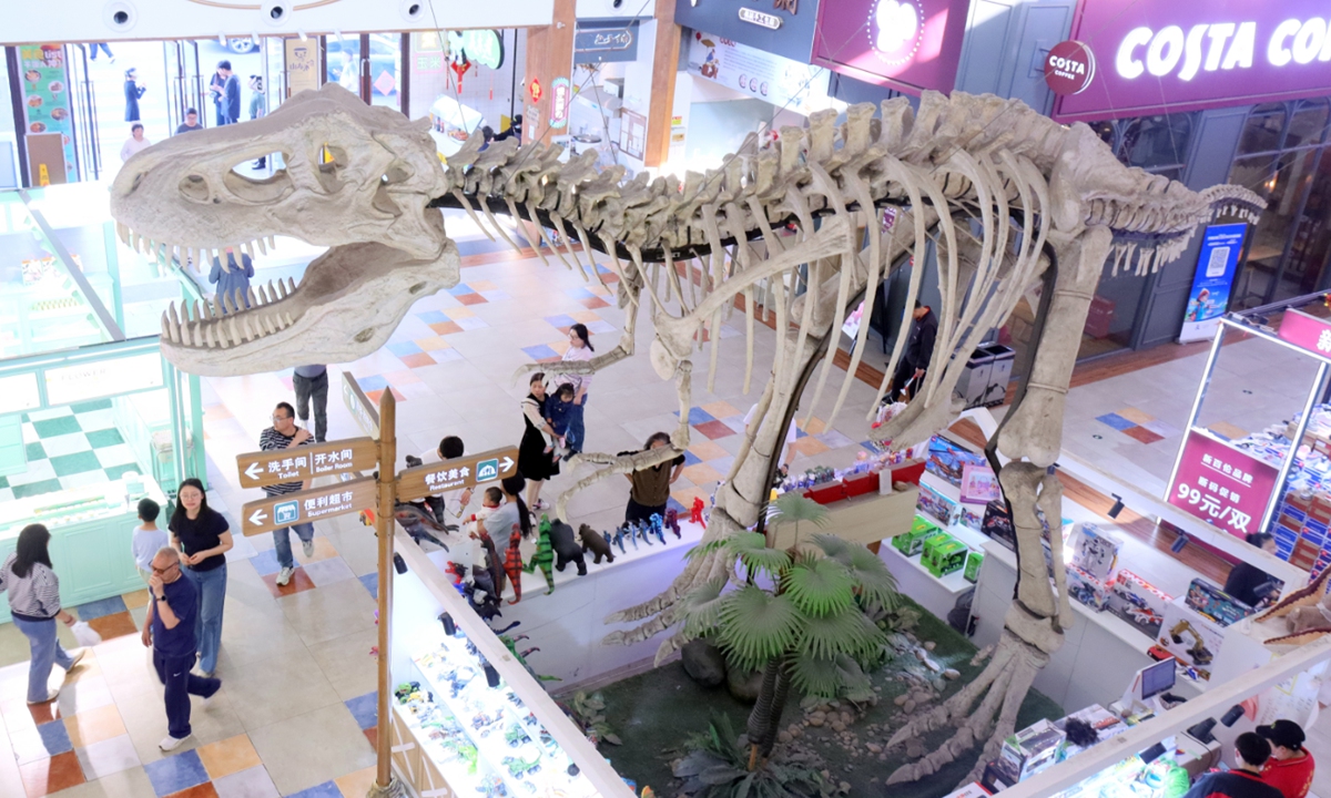 Tourists visit the Fangmaoshan Dinosaur Highway Service Area on April 6, 2025, in Changzhou, East China's Jiangsu Province. The service area has introduced a new business model of 