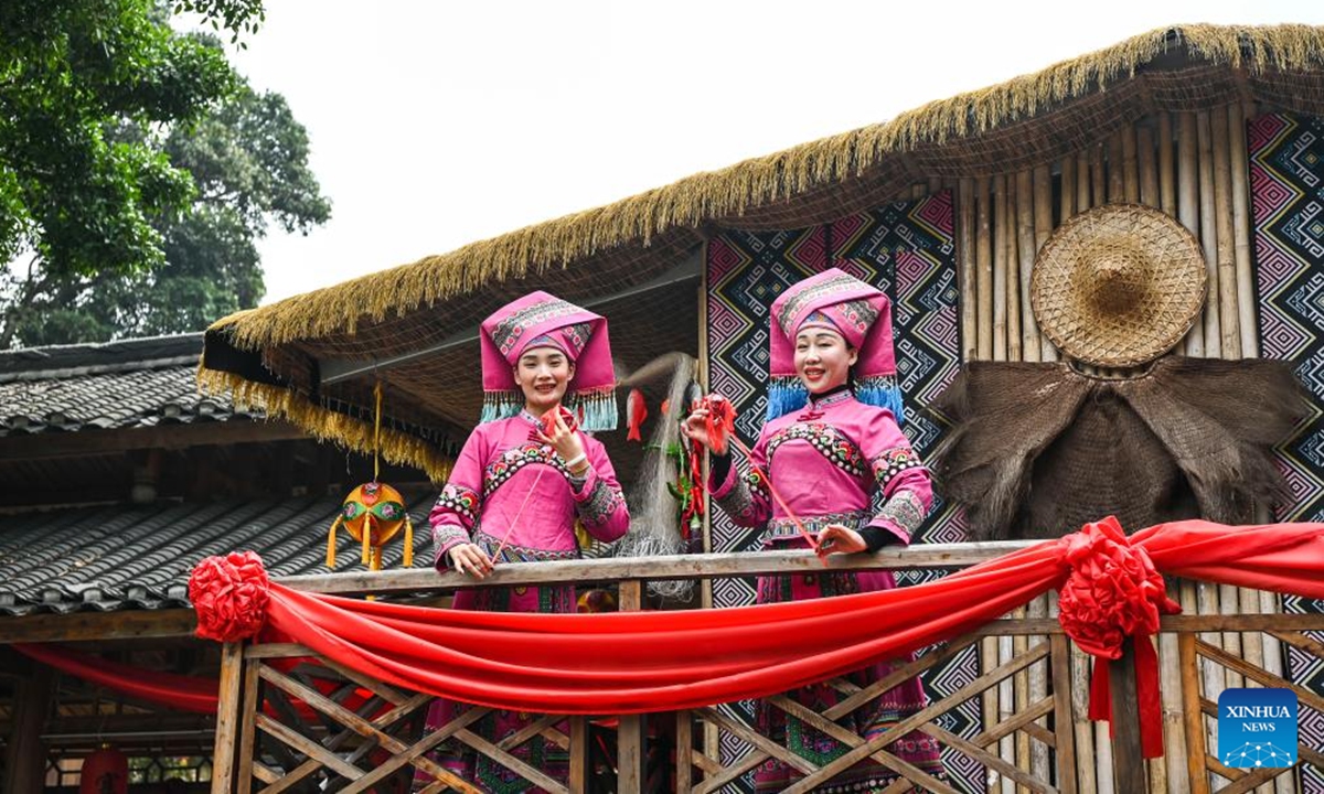 Artists performs with embroidered balls in Hechi, south China's Guangxi Zhuang Autonomous Region, Jan. 24, 2025. Guangxi Zhuang Autonomous Region is the autonomous region with the largest population of ethnic minorities in China, with multiple ethnic groups such as Zhuang, Yao, Miao, and Dong who have lived there for generations. Throwing embroidered balls is a traditional sport that Guangxi people enjoy, carrying a profound folk heritage. In Zhuang culture, embroidered ball is a symbol of love. (Photo: Xinhua)

