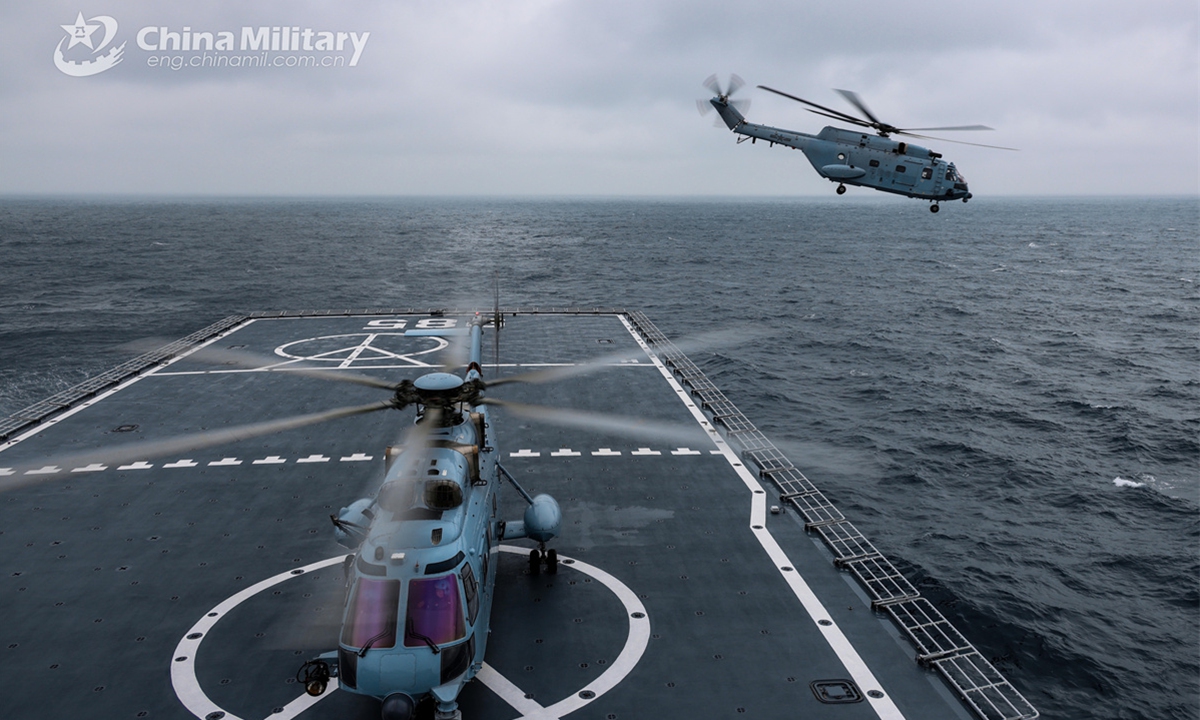 Ship-borne helicopters lift off successively from the flight deck of the amphibious dock landing ship Qilianshan (Hull 985) during counterterrorism and anti-piracy operations on March 30, 2025. China-Thailand Blue Strike 2025 joint naval training was held in south China's Guangdong Province from March 26 to April 2, 2025. During the joint training, both sides' participating troops conducted joint underwater mine countermeasure operation, anti-ship strike, maritime search and rescue, and field survival operation, as well as other training subjects both in the sea and land domains. (eng.chinamil.com.cn/Photo)