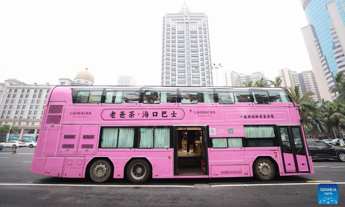 A Laobacha Haikou Bus, which runs on a China International Consumer Products Expo special route, is seen in Haikou, south China's Hainan Province, April 6, 2025. Ahead of the upcoming fifth China International Consumer Products Expo (CICPE), the Laobacha Haikou Bus has inaugurated its CICPE special route. Laobacha is a beloved Hainan tradition where locals gather over fragrant tea, savory snacks, and leisurely chat.  (Photo: Xinhua)