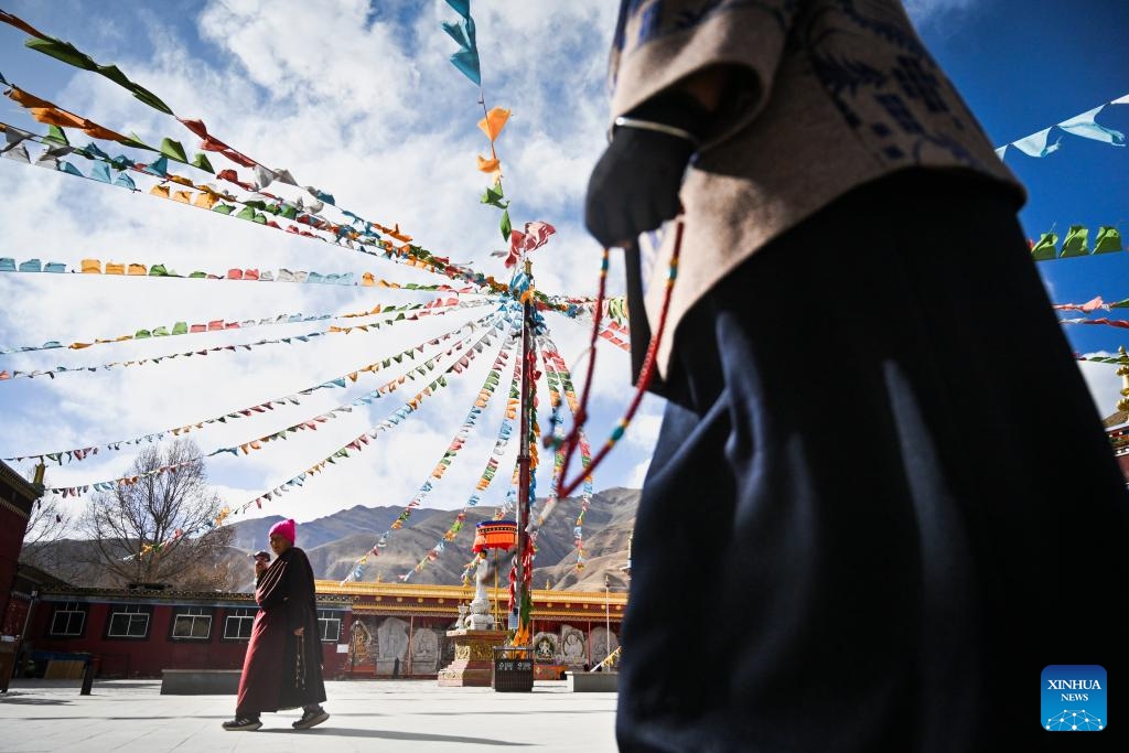 People pray as they circle the Jiana mani stone mound in Yushu City, Yushu Tibetan Autonomous Prefecture, northwest China's Qinghai Province, April 6, 2025. The Jiana mani stone mound is a cultural relic under national protection. The mound is composed of billions of mani stones and used by local people when they hold prayers' wheels and mutter the six-syllable prayer to observe their daily ritual. (Xinhua/Zheng Huansong)