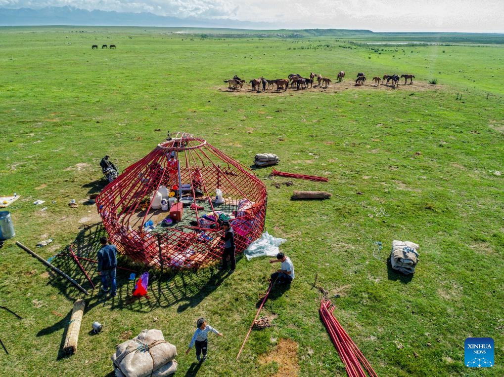 An aerial photo taken on July 7, 2017 shows herders setting up a yurt at a pasture in Tekes County, Ili Kazak Autonomous Prefecture, northwest China's Xinjiang Uygur Autonomous Region. Established in the 1930s, Tekes is located deep in the Ili River Valley on the northern slopes of the Tianshan Mountains. The county is renowned for its Bagua (or Eight Trigrams) layout: from the central Tai Chi Plaza, eight main streets extend outward in a progressive and radial pattern, while the roads are interconnected. (Photo: Xinhua)
