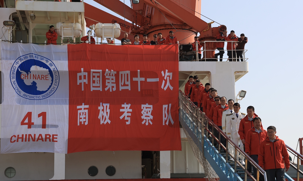 Members of China's 41st Antarctic expedition team disembark from the country's research icebreaker Xuelong, or <em>Snow Dragon</em>, at a base dock in Shanghai, East China, on April 8, 2025. Xuelong arrived in Shanghai on the day, marking the completion of key missions in the country's 41st Antarctic expedition. Photo: VCG