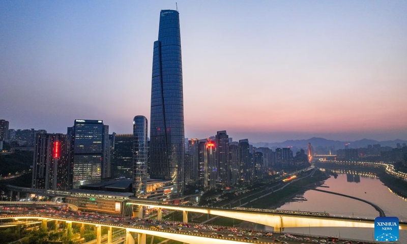 An aerial drone photo taken on April 9, 2025 shows an external view of the international land-sea center in southwest China's Chongqing Municipality. The construction of facade curtain wall of the international land-sea center, the tallest building under construction in Chongqing, was officially completed on Wednesday. Located in Yuzhong District, the 458-meter-high skyscraper has a curtain wall area of about 100,000 square meters, and more than 18,000 glass plates are used. (Photo: Xinhua)