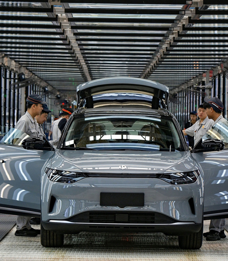 Workers complete assembling an electric vehicle (EV) at China's EV start-up Leapmotor in Jinhua, East China's Zhejiang Province on April 1, 2024. The smart EV factory delivered 14,567 new vehicles in March, a yearly increase of 136 percent. Photo: VCG