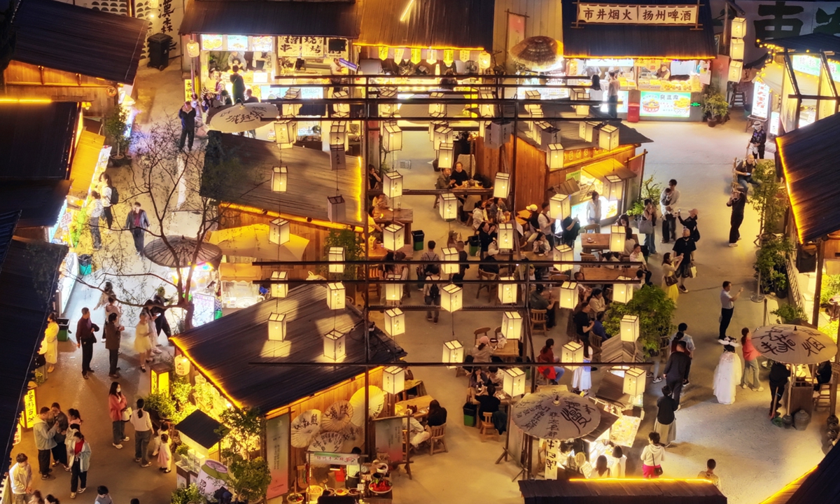 People enjoy themselves on Dongguan Street, one of the most famous ancient streets in Yangzhou that dates back to the Ming Dynasty (1368-1644), in Yangzhou, Jiangsu Province, on April 15, 2025. Photo: VCG