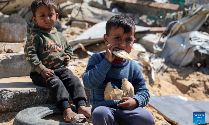 Displaced Palestinian children are seen at a temporary shelter in Gaza City, on April 15, 2025. (Photo: Xinhua)
