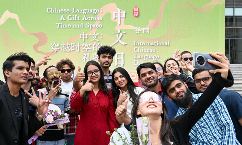 Chinese and foreign students from universities and colleges gather together to take photos and experience traditional Chinese culture at Yunnan Normal University on April 17, 2025. The event was part of celebration activities for International Chinese Language Day which falls on April 20. Photo: VCG