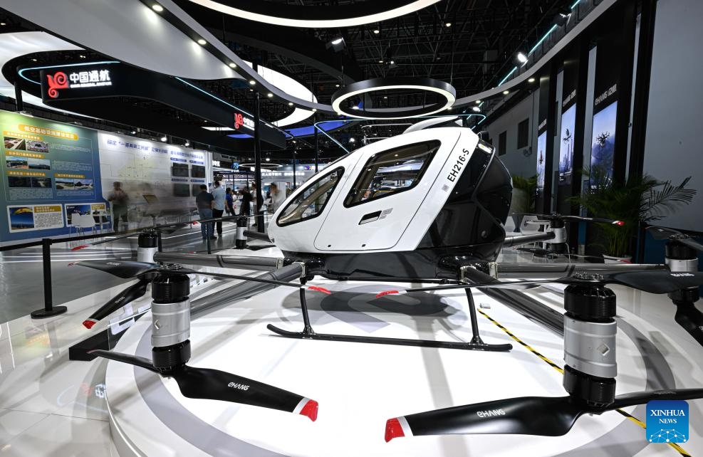 This photo shows a passenger-carrying drone at the booth of EHang at the 5th China International Consumer Products Expo (CICPE) in Haikou, south China's Hainan Province, April 14, 2025. From intangible cultural heritage skills to technological trendy products, Chinese brands showcased its charm at the ongoing CICPE in Haikou, attracting the attention of many visitors. (Photo: Xinhua)