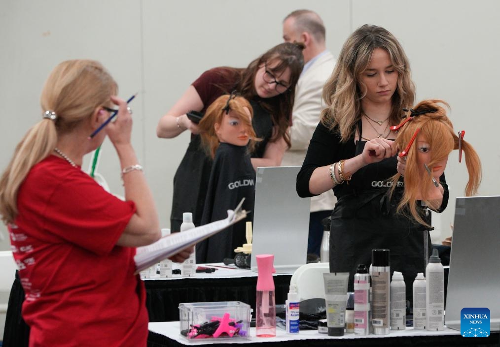 Contestants compete in the Hairstyling category at the 2025 Provincial Trade and Technology Competition in Abbotsford, British Columbia, Canada, on April 16, 2025. Over 600 secondary and post-secondary students competed here Wednesday in trade and technology contests, including carpentry, plumbing, electrical, baking, welding, graphic design, 3D animation, robotics, and more. (Photo: Xinhua)