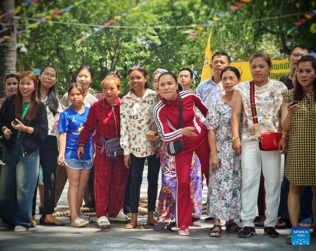 People take part in a blessing activity to celebrate the Cambodian New Year in Phnom Penh, Cambodia, April 14, 2025. Phnom Penh, capital of the Kingdom of Cambodia, is located beside the confluence of the Mekong and Tonle Sap rivers. The coexistence of traditional architecture and modern buildings endows the city with life and vitality. (Photo: Xinhua)