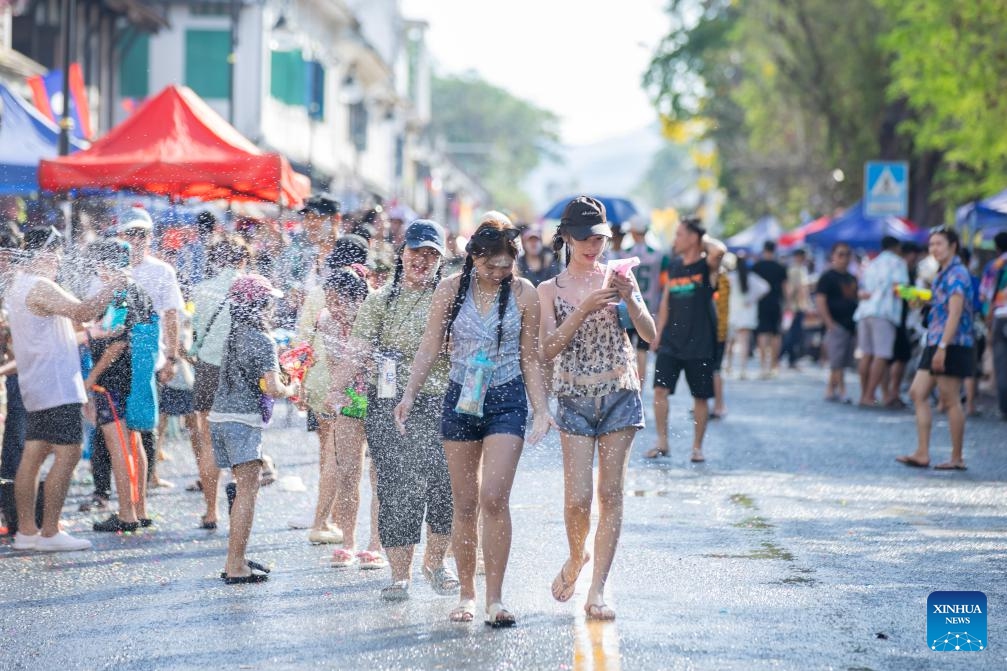 People participate in the celebration of the Songkran Festival in Luang Prabang, Laos, April 15, 2025. Laos celebrates the Songkran Festival, or the Lao New Year from April 14 to 16 this year. A series of celebrations are held to celebrate this traditional festival. (Photo: Xinhua)