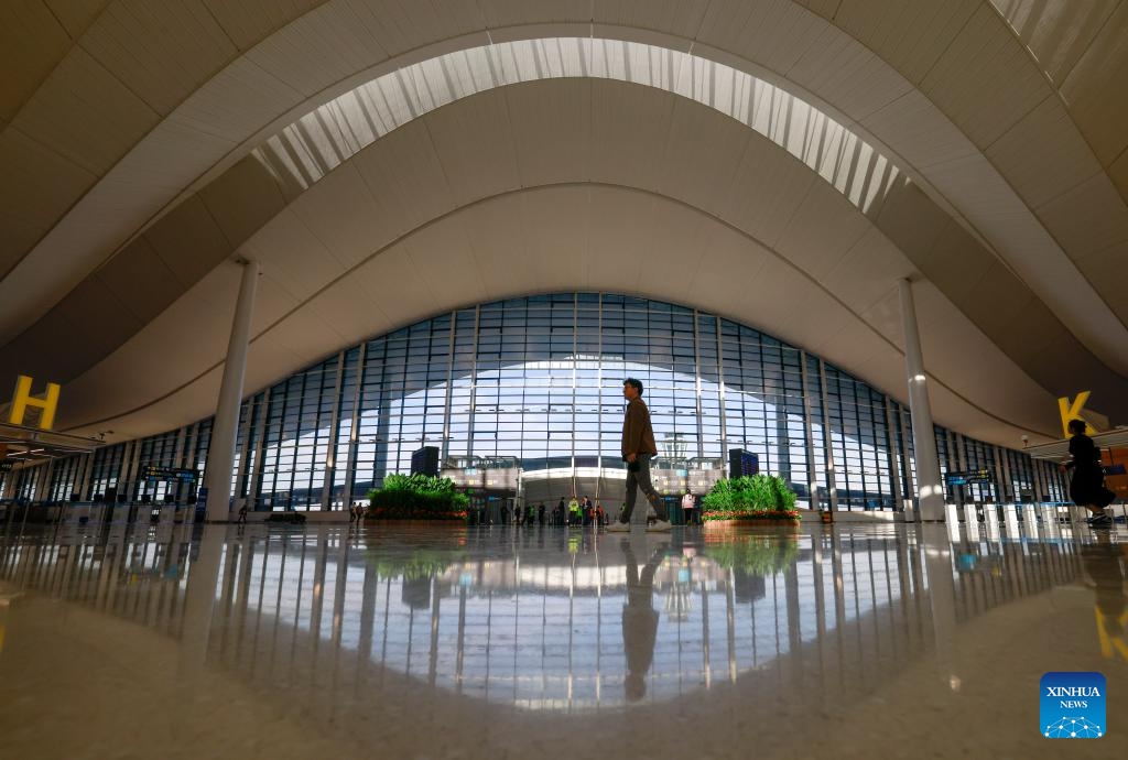 People walk at the departure hall of a new terminal at Urumqi Tianshan International Airport in Urumqi, northwest China's Xinjiang Uygur Autonomous Region, April 15, 2025. A new terminal at Urumqi Tianshan International Airport in northwest China's Xinjiang Uygur Autonomous Region began trial operations on Thursday, marking a major step in expanding regional air capacity.  (Photo: Xinhua)