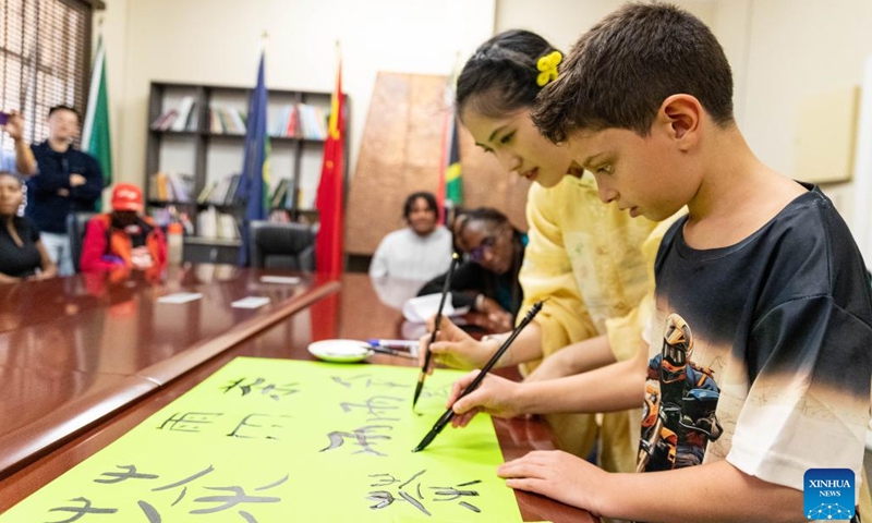 A student writes Chinese calligraphy during an event celebrating the upcoming International Chinese Language Day at the Confucius Institute at the University of Johannesburg in Johannesburg, South Africa, April 17, 2025. (Photo: Xinhua)