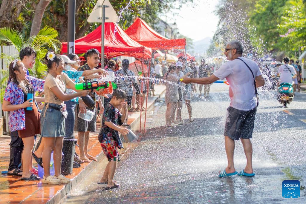 People participate in the celebration of the Songkran Festival in Luang Prabang, Laos, April 15, 2025. Laos celebrates the Songkran Festival, or the Lao New Year from April 14 to 16 this year. A series of celebrations are held to celebrate this traditional festival. (Photo: Xinhua)