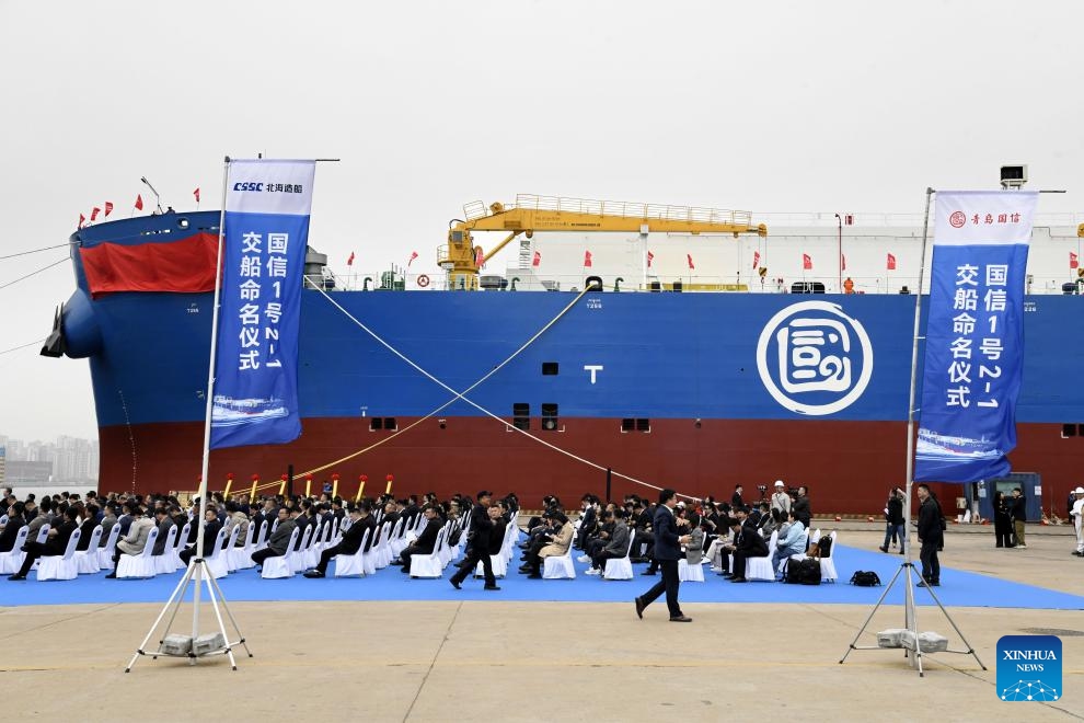 People attend a delivery ceremony for a deep-sea intelligent aquaculture vessel berthed at the port of Beihai yard in Qingdao, east China's Shandong Province, April 17, 2025. (Photo: Xinhua)
