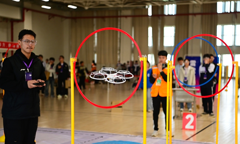 Participants compete in an individual flight race at the 9th Educational Drone Event in Liaocheng, East China's Shandong Province, on April 20, 2025. Photo: VCG