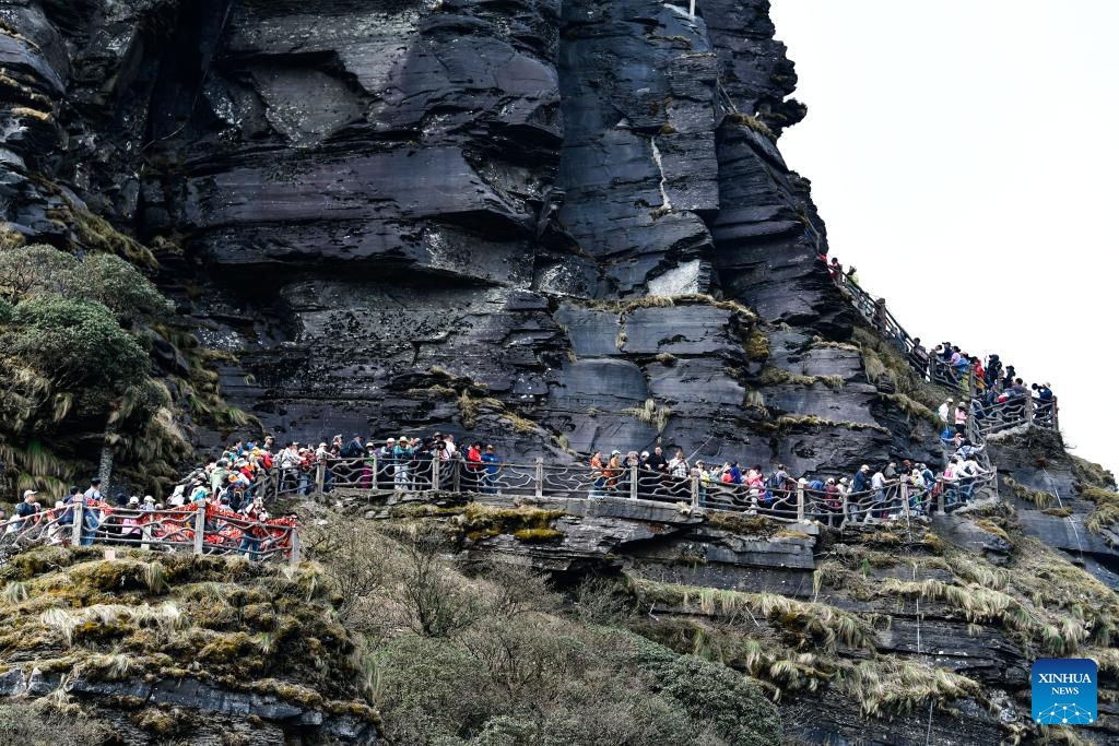 Tourists visit the Mount Fanjing in Tongren City, southwest China's Guizhou Province on April 15, 2025. Mount Fanjing is a World Heritage Site that covers an area of 775 square kilometers. It not only provides an important glimpse into geological evolution in southern China but also serves as an ecological security barrier in the middle and upper reaches of the Yangtze River. (Photo: Xinhua)