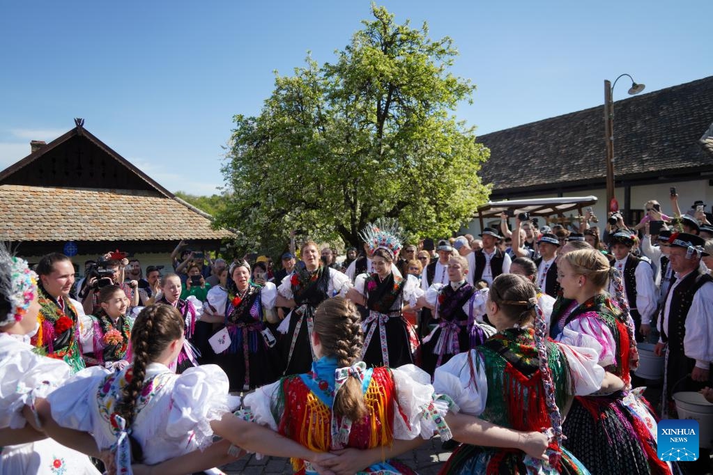 People in traditional costumes celebrate Easter in Holloko, Hungary, on April 21, 2025. (Photo: Xinhua)