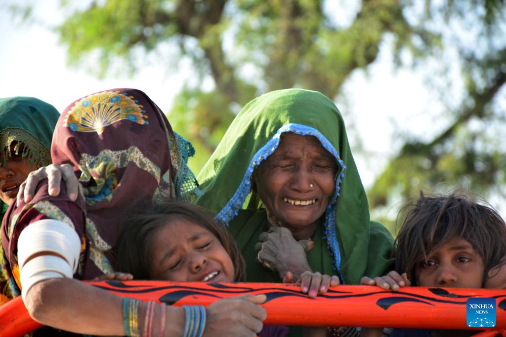 Relatives of the victims in a road accident are pictured in the Jamshoro district in Pakistan's southern Sindh province, April 22, 2025. At least 13 people were killed and 20 others injured in a road accident in Pakistan's southern Sindh province on Monday night, local authorities confirmed Tuesday. The incident occurred in the Jamshoro district, where a passenger van carrying more than 30 people veered off the road and plunged into a ravine, according to local police sources. (Photo: Xinhua)