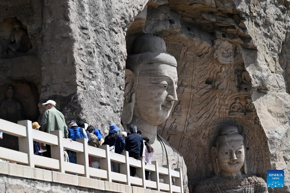 Tourists visit Yungang Grottoes in Datong, north China's Shanxi Province, April 15, 2025. Yungang Grottoes was built during the Northern Wei Dynasty (386-534). It is considered a pinnacle of Chinese Buddhist art and represents the highest level of sculptural artistry in the world during the 5th century. In recent years, Shanxi has made great efforts to protect and study the grottoes. In 2021, the research institute of the Yungang Grottoes was established for the protection, research and management of the Yungang Grottoes. (Photo: Xinhua)