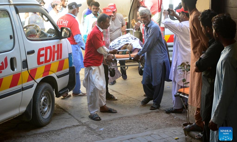 Rescuers transfer an injured person in a road accident to a hospital in the Jamshoro district in Pakistan's southern Sindh province, April 22, 2025. At least 13 people were killed and 20 others injured in a road accident in Pakistan's southern Sindh province on Monday night, local authorities confirmed Tuesday. The incident occurred in the Jamshoro district, where a passenger van carrying more than 30 people veered off the road and plunged into a ravine, according to local police sources. (Photo: Xinhua)