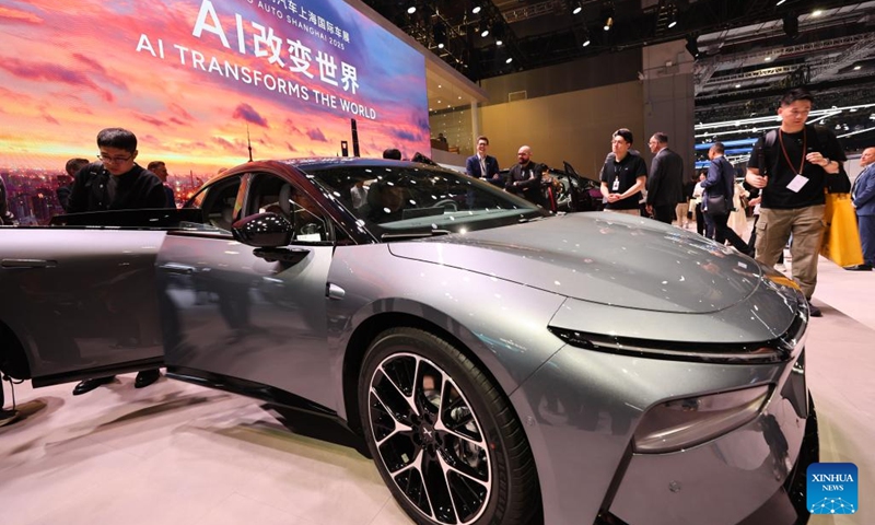 Visitors look at an Xpeng G7 on display during the 21st Shanghai International Automobile Industry Exhibition in east China's Shanghai, April 23, 2025. Themed Embracing Innovation, Empowering the Future, the exhibition, also known as Auto Shanghai 2025, kicked off here on Wednesday, attracting nearly 1,000 noted enterprises from 26 countries and regions. (Photo: Xinhua)