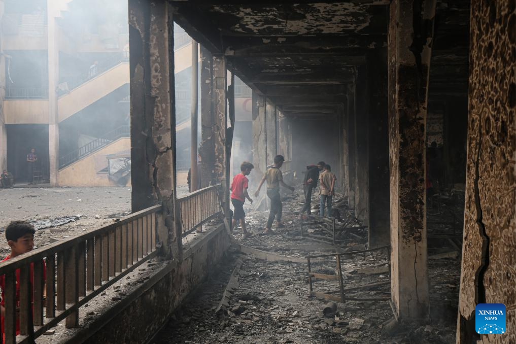 Palestinian children are seen at a school after an Israeli airstrike in Gaza City, on April 23, 2025. Israel's Shin Bet domestic security agency and the military said on Wednesday that a deadly overnight airstrike targeting a school sheltering displaced families in northern Gaza was aimed at militants. Gaza's health authorities said the strike killed at least 10 people and caused fires in tents and classrooms at the school. (Photo: Xinhua)