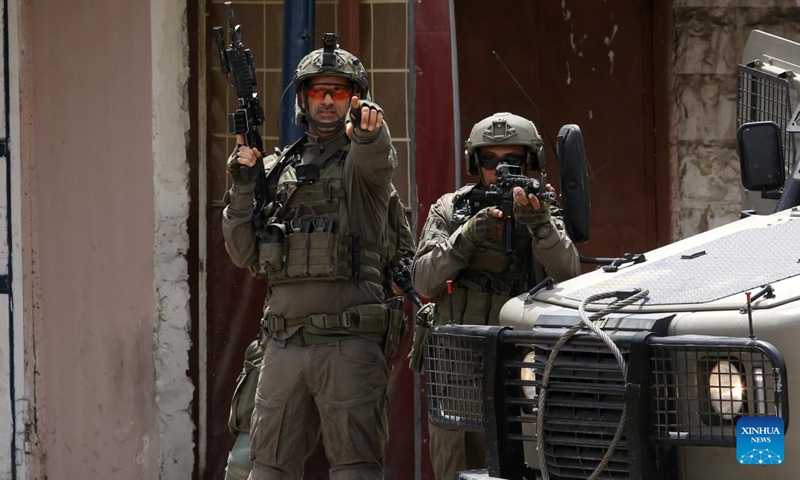 Israeli soldiers are seen during a military operation in the Balata refugee camp, east of Nablus in the northern West Bank, on April 24, 2025. (Photo: Xinhua)