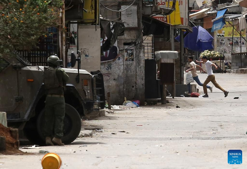 An Israeli soldier is seen during a military operation in the Balata refugee camp, east of Nablus in the northern West Bank, on April 24, 2025. (Photo: Xinhua)