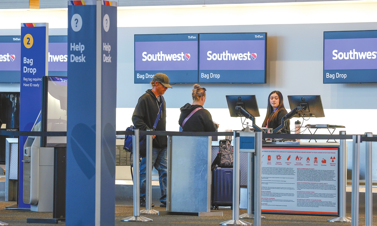 A Southwest Airlines ticketing agent helps customers at San Francisco International Airport on April 24, 2025 in San Bruno, California. Photo: VCG