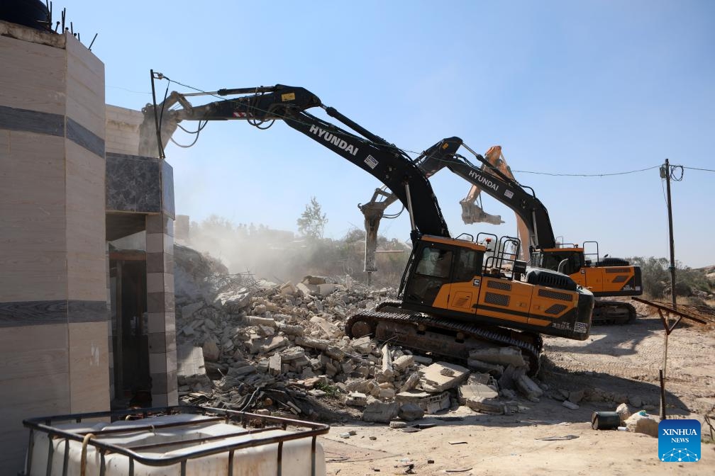 Israeli excavators demolish a house in the village of Idna, west of the West Bank city of Hebron, on April 28, 2025 The houses here were demolished due to a lack of Israeli-issue building permits, which Palestinians say are nearly impossible to obtain. (Photo: Xinhua)