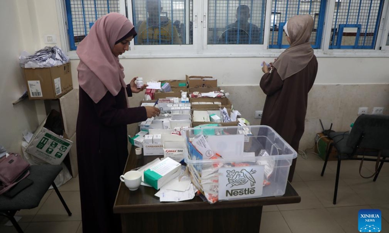Palestinians work at a United Nations Relief and Works Agency for Palestine Refugees in the Near East (UNRWA) health center, west of Gaza City, amid a shortage of medicine due to Israel's continued closure of the border crossings in the Gaza Strip, on April 28, 2025. (Photo: Xinhua)