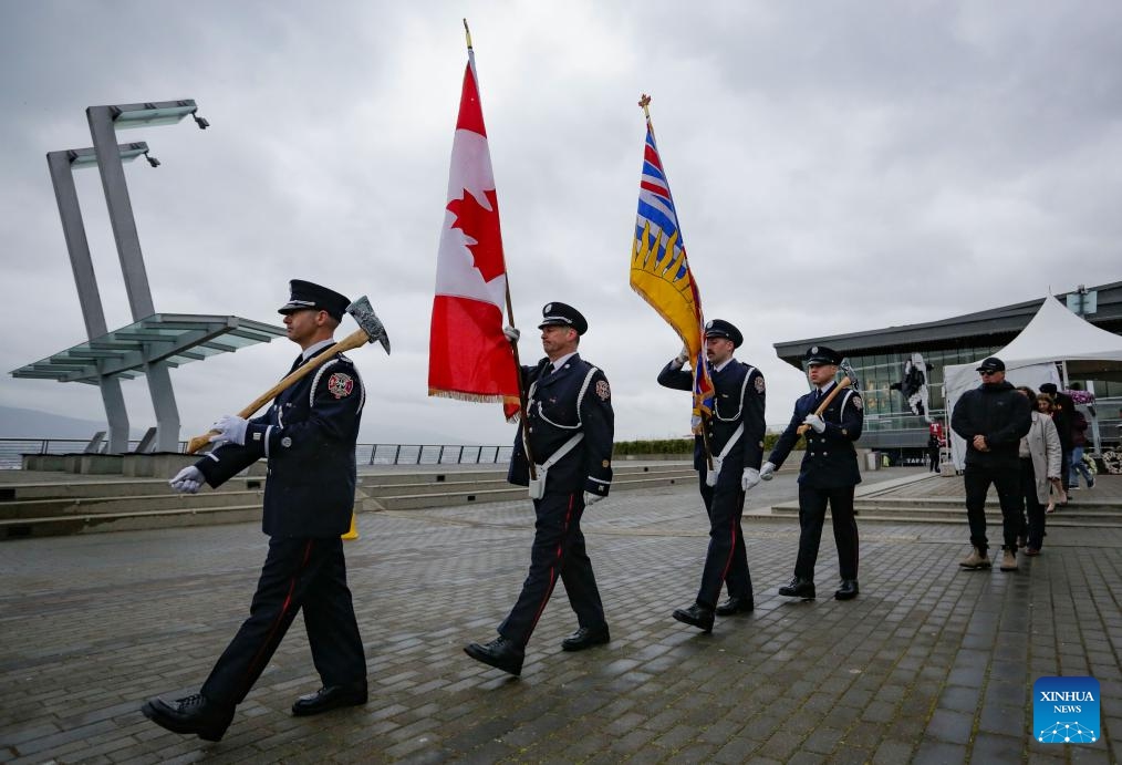 Members of the Vancouver Fire and Rescue Department lead the procession during the National Day of Mourning event in Vancouver, British Columbia, Canada, on April 28, 2025. The National Day of Mourning is observed annually in Canada on April 28 to commemorate people who have lost their lives, suffered injury or illness on the job, or experienced a work-related tragedy, and to raise awareness of health and safety in the workplace. (Photo: Xinhua)