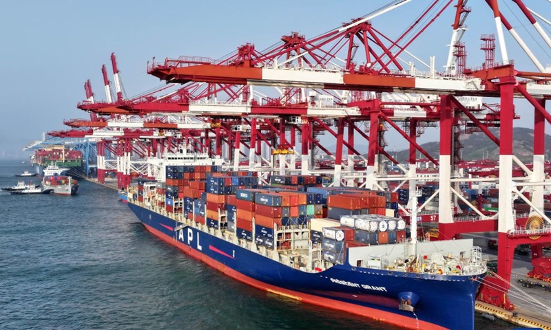 An aerial drone photo taken on April 30, 2025 shows a cargo ship berthing at a container dock of Qingdao Port in Qingdao, east China's Shandong Province. This year, Qingdao port has actively expanded its international shipping routes, especially for the Association of Southeast Asian Nations (ASEAN). The direct cargo shipping routes from Qingdao Port to the ASEAN countries has increased to 50, with the cargo volume from Qingdao to ASEAN countries up six percent year-on-year in the first quarter of this year. (Xinhua/Li Ziheng)