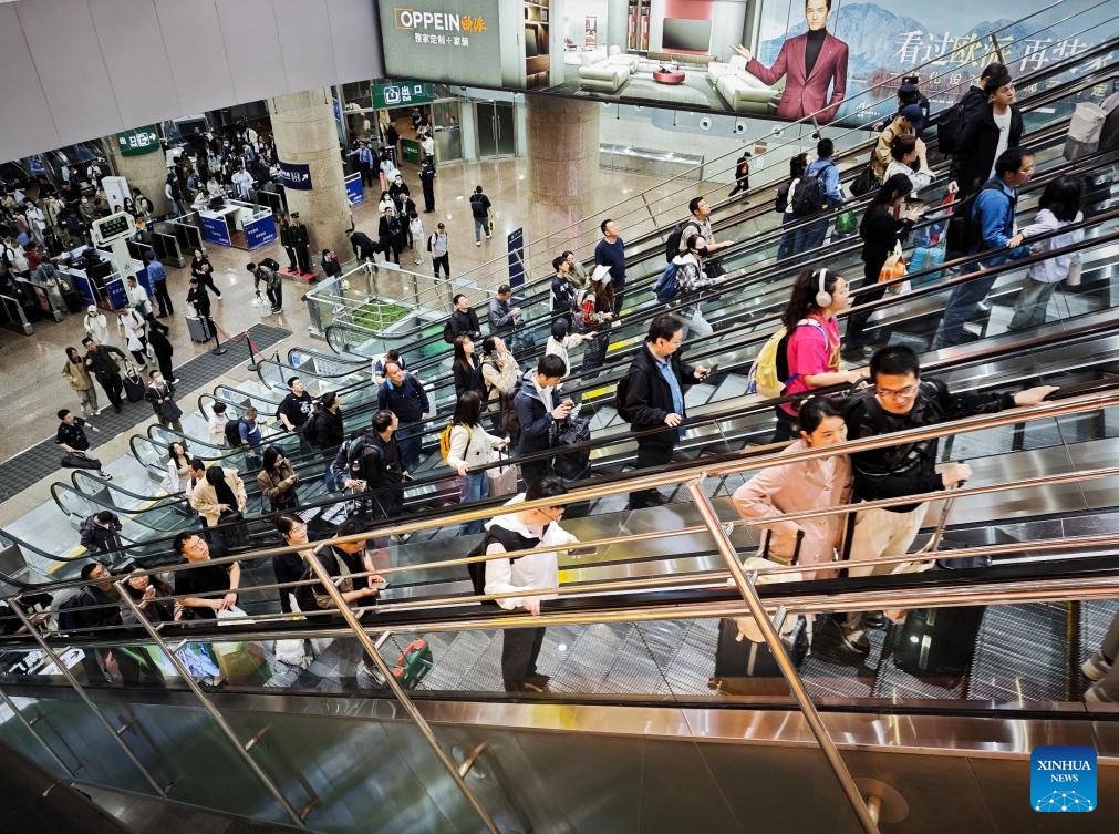 Passengers are seen at Beijing West Railway Station in Beijing, capital of China, April 30, 2025. China's railway network is expected to handle approximately 144 million passenger trips during the eight-day May Day holiday travel rush, which kicked off on Tuesday, the national railway operator said. (Xinhua/Xing Guangli)