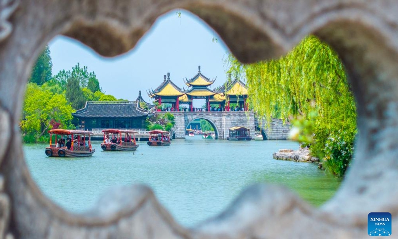 An aerial drone photo taken on April 30, 2025 shows tourists visiting Slender West Lake scenic spot in Yangzhou, east China's Jiangsu Province. Visitor numbers at nationwide tourist attractions have risen as the May Day holiday approaches.
As one of the three longest holidays in China, the upcoming five-day holiday from May 1 to May 5 is expected to see a tourism boom. (Photo by Zhou Shegen/Xinhua)