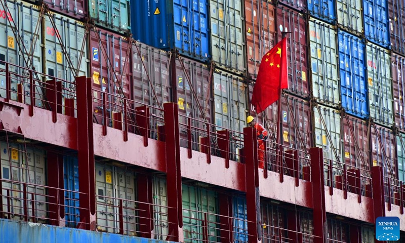 A worker checks the piling of containers on a ship at a cargo dock of Qingdao Port in Qingdao, east China's Shandong Province, April 30, 2025. This year, Qingdao port has actively expanded its international shipping routes, especially for the Association of Southeast Asian Nations (ASEAN). The direct cargo shipping routes from Qingdao Port to the ASEAN countries has increased to 50, with the cargo volume from Qingdao to ASEAN countries up six percent year-on-year in the first quarter of this year. (Xinhua/Li Ziheng)