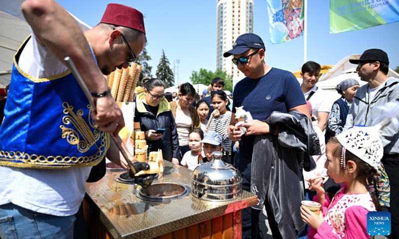A vendor sells ice cream during a festival celebrating Kazakhstan's National Unity Day in Almaty, Kazakhstan, on May 1, 2025. Photo: Xinhua