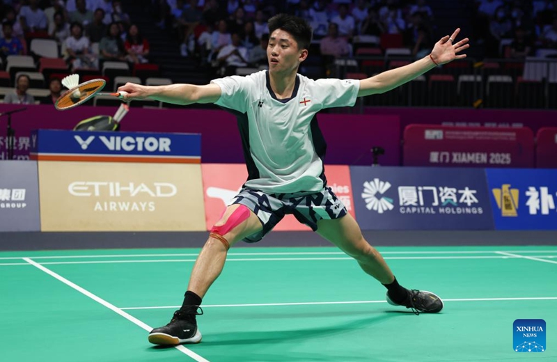 Harry Huang of England hits a return during the men's singles match against Sathish Kumar Karunakaran of India of the Group D match between India and England at BWF Sudirman Cup in Xiamen, southeast China's Fujian Province, May 1, 2025. Photo: Xinhua