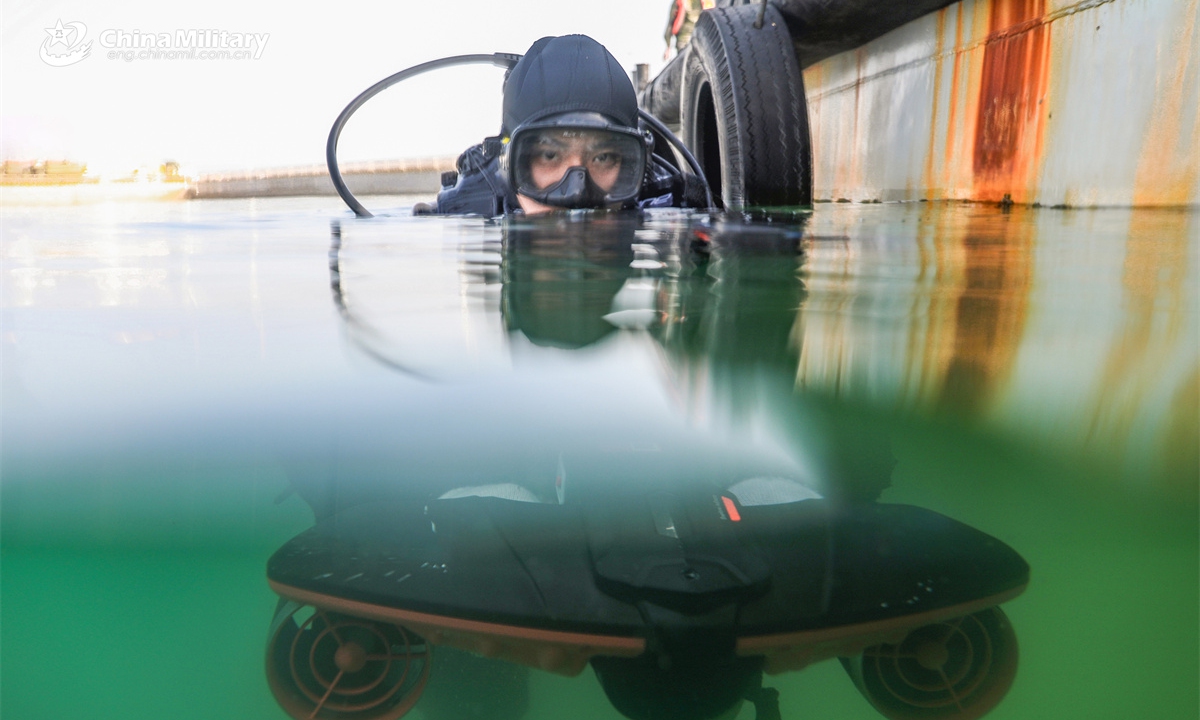 A frogman assigned to a naval base under the Chinese PLA Northern Theater Command conducts training with an underwater scooter in the water during an underwater training exercise on April 15, 2025. (eng.chinamil.com.cn/Photo by Liu Zaiyao)