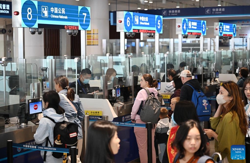 Tourists line up to pass through passenger clearance procedures at Tianjin International Cruise Home Port in north China's Tianjin Municipality, May 1, 2025. Tianjin International Cruise Home Port welcomed the simultaneous berthing of three international cruise ships on the first day of May Day holiday, which was the first time since its resumption of operations. According to statistics, on May 1, the number of inbound and outbound passengers reached nearly 15,000, with over 400 travelers applying for visa-free entry with a period of 240 hours. Photo: Xinhua