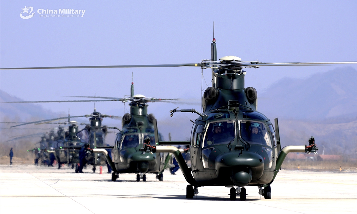 A cluster of Z-9 helicopters attached to an army aviation brigade under the Chinese PLA 79th Group Army get ready for a flight training exercise. (eng.chinamil.com.cn/Photo by Qi Dong and Wang Lijun)