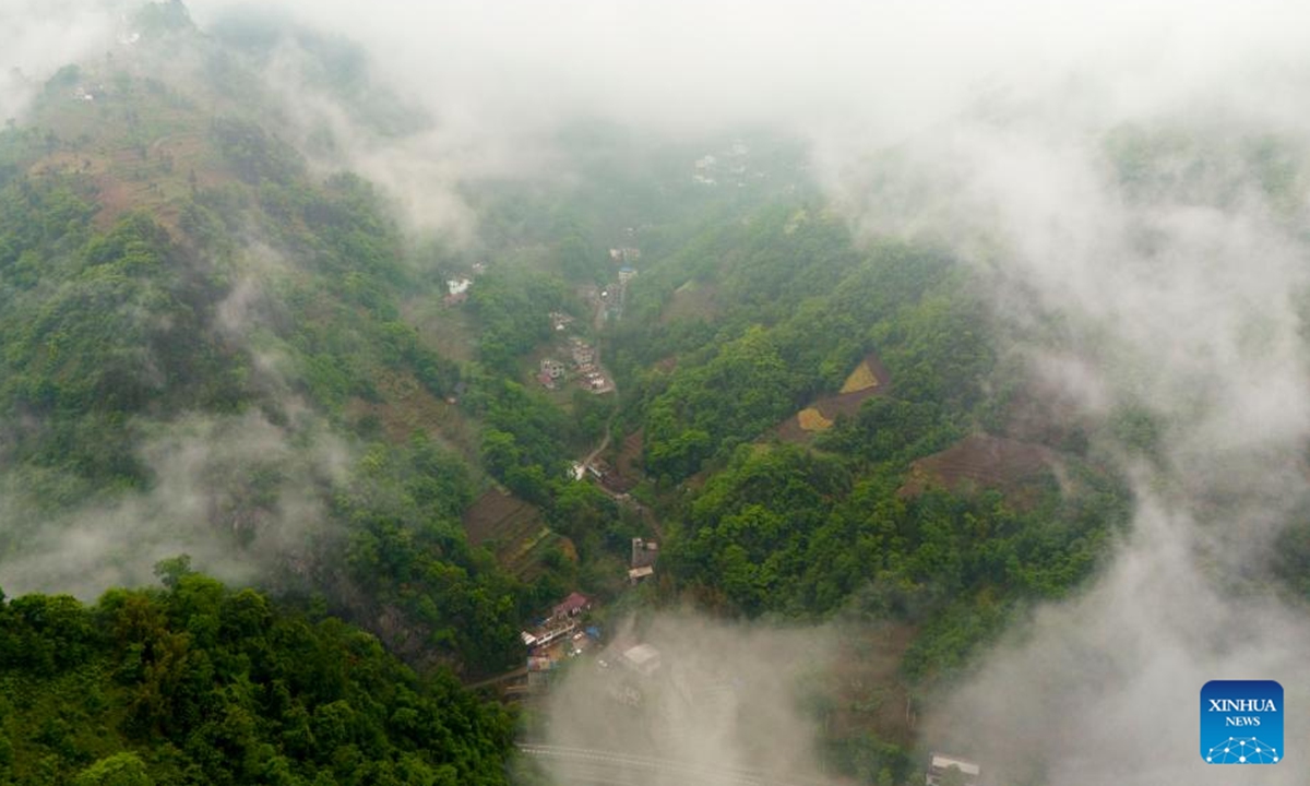 An aerial drone photo taken on April 29, 2025 shows a view of Wangu Village of Yanjin County, Zhaotong City, southwest China's Yunnan Province. Li Runnan, born in 1996, graduated from Peking University in 2023 and began working as a village cadre in Wangu Village of Yanjin County, Yunnan Province the following year.



