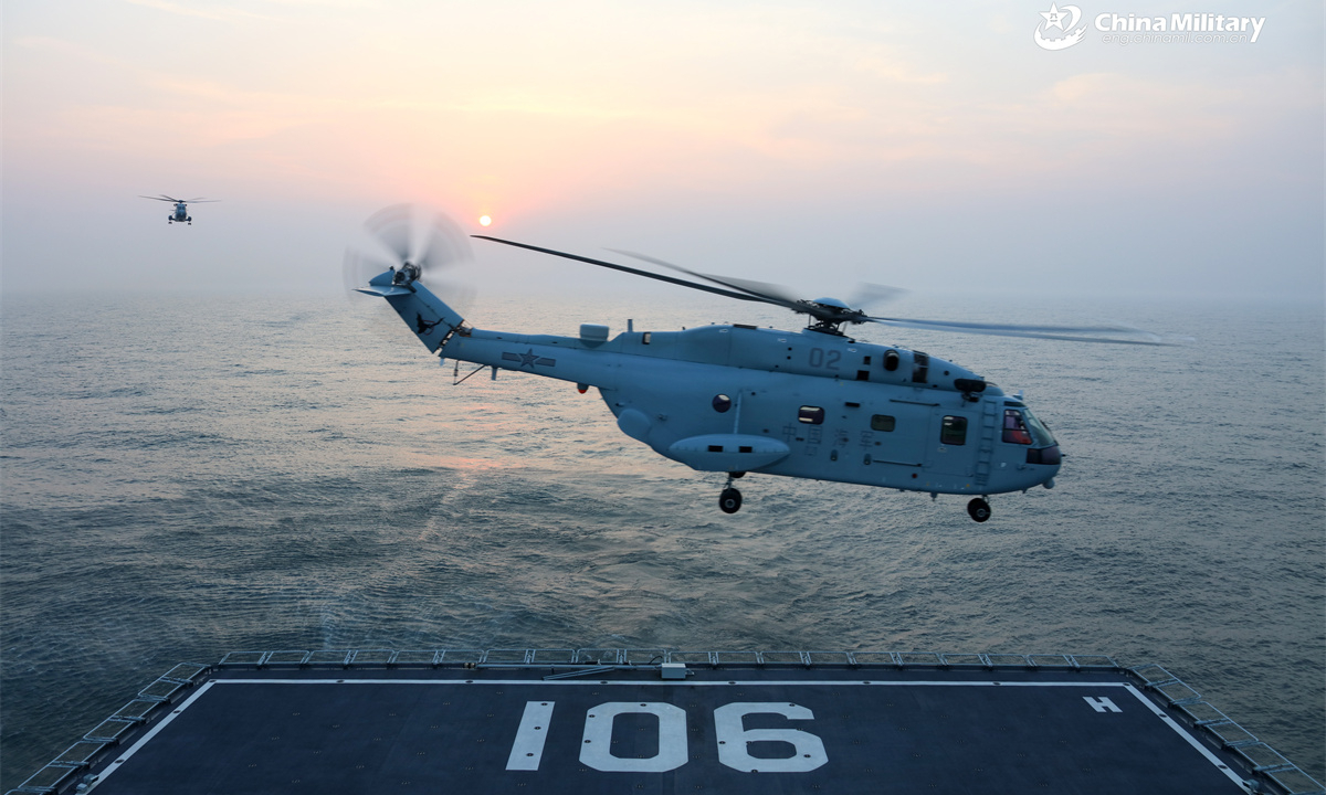 The comprehensive supply ship Hulunhu (Hull 901) attached to a combat support ship flotilla with the navy under the Chinese PLA Northern Theater Command practices tactical coordination with a ship-born helicopter during a multi-subject training exercise in late April, 2025. (eng.chinamil.com.cn/Photo by Xu Taotao)