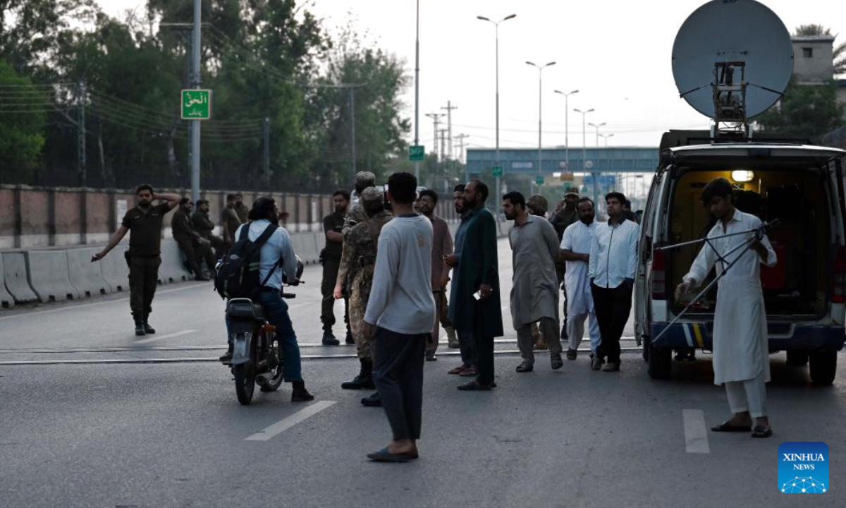 Security personnel stop people on a road leading to Nur Khan Air Base following Indian missile strike in Rawalpindi, Pakistan, May 10, 2025. India launched missile and drone strikes in multiple areas of Pakistan, including three airbases of the Pakistan Air Force (PAF), and also resorted to unprovoked firing along the international border in eastern Punjab province, Pakistani officials and sources confirmed in the wee hours of Saturday. (Xinhua)