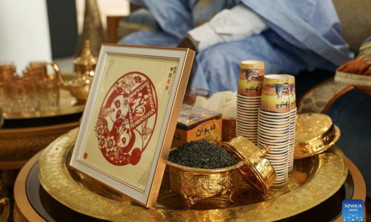 A piece of Chinese paper-cutting work is pictured at a stand for Moroccan tea art demonstration during Tea for Harmony: Yaji Cultural Salon, in Rabat, Morocco, May 9, 2025. A culture and tourism promotion event of east China's Jiangxi Province was held here Friday to showcase the elegance and flavor of the Chinese tea and the cultural charm of Jiangxi to the Moroccan public. (Xinhua/Huo Jing)