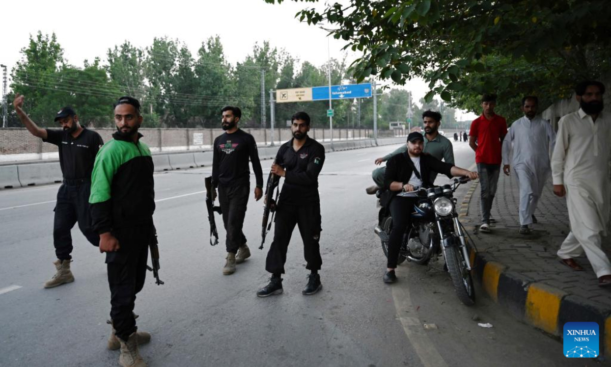 Security personnel patrol on a road leading to Nur Khan Air Base following Indian missile strike in Rawalpindi, Pakistan, May 10, 2025.India launched missile and drone strikes in multiple areas of Pakistan, including three airbases of the Pakistan Air Force (PAF), and also resorted to unprovoked firing along the international border in eastern Punjab province, Pakistani officials and sources confirmed in the wee hours of Saturday. (Xinhua)